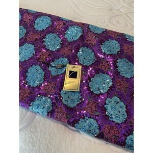 Vibrant purple and turquoise fabric adorned with sequins and floral patterns 5yd